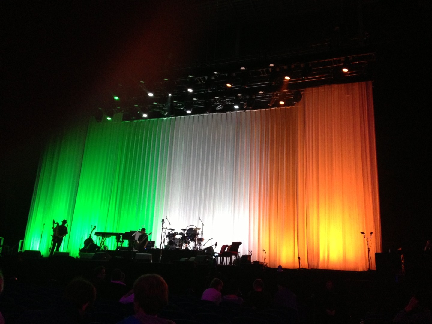 Curtains lit in the colours of the Irish flag (green, white and orange) before Leonard Cohen's Dublin show