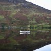 Boat reflected in Loch Long at&nbsp;Dornie